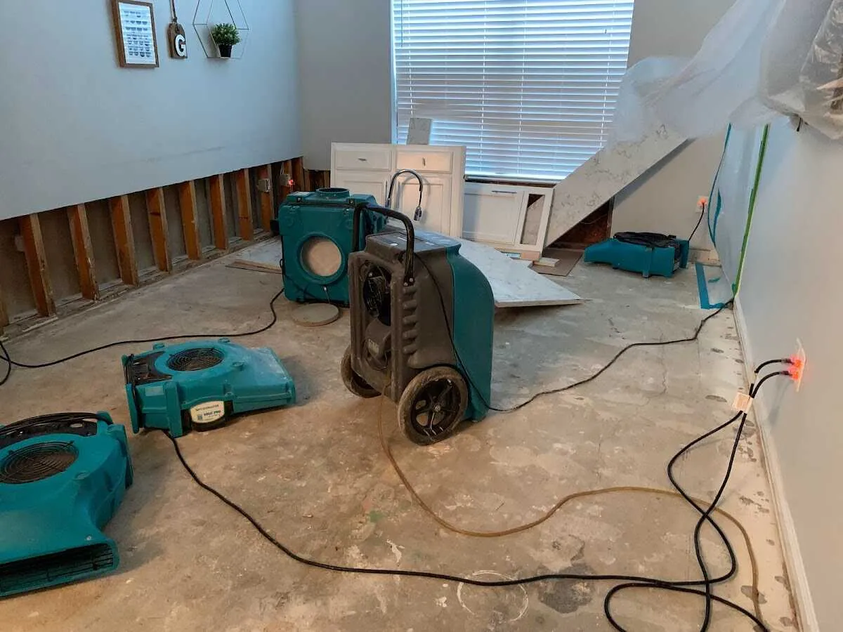 Dehumidifier in flood-cut room for Water Damage Restoration in Woodland Park